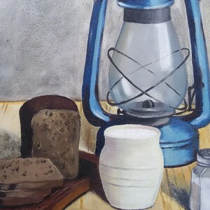 May include: A still life painting of a blue oil lamp, a loaf of bread, two slices of bread on a wooden cutting board, a white ceramic pitcher, and a salt shaker on a wooden table.