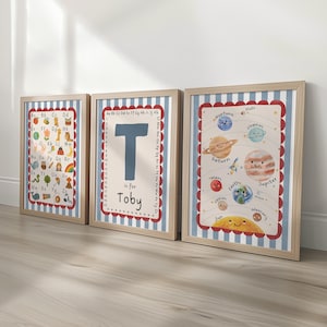 May include: Three framed educational prints. The prints feature the alphabet, the letter "T" with the name "Toby", and a solar system diagram. Each print has a light wood frame and a blue and white striped background.