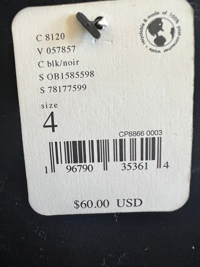 May include: White tag with black text, including product codes, size 4, and a barcode. The tag also includes the text "$60.00 USD".