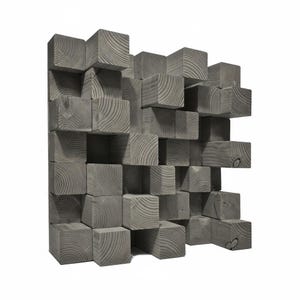 May include: A square acoustic panel composed of multiple grey wooden blocks of varying depths. The blocks are arranged in a grid pattern, each displaying a visible circular wood grain texture on its front face, creating a three-dimensional surface.