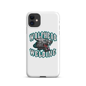 May include: White phone case featuring a gray wolf head graphic with the text "WOLFHEAD WELDING" in teal. The wolf has blue eyes and is baring its teeth. The case is designed for an iPhone.