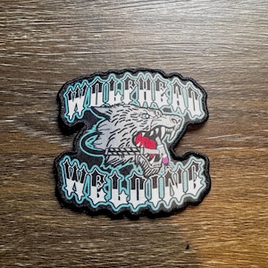 Toppa termoadesiva con logo Wolfhead Welding: accenti verde acqua