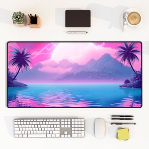 May include: A pink and blue desktop mouse pad with a digital art design of a tropical island with palm trees, mountains, and a large moon in the sky.