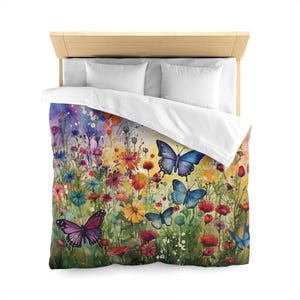 May include: A colourful watercolour painting of a field of flowers with butterflies. The butterflies are in various shades of blue and purple, and the flowers are in shades of pink, yellow, orange, and red.