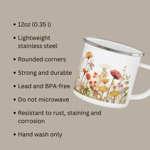 May include: A white stainless steel mug with a 12oz capacity, featuring a colorful floral print of wildflowers. The mug has rounded corners and is lead and BPA-free. It is resistant to rust, staining, and corrosion. Hand wash only, do not microwave.