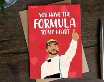 May include: A red card with a cartoon illustration of a race car driver giving a thumbs up. The card says "You have the formula to my heart".