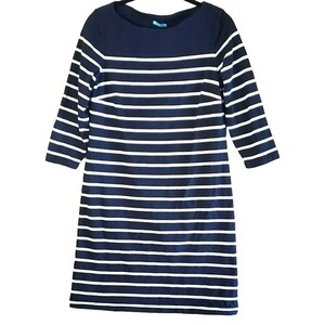 May include: A navy blue and white striped dress with a boat neck and 3/4 sleeves.