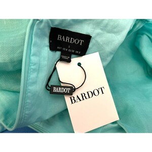 May include: A turquoise blue Bardot brand dress with a black tag that says "Bardot" and "S" for size. The tag also says "AUS 4 USA 4 EU 36 UK 8" and "Made in China".