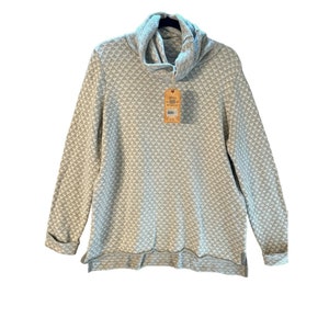 May include: A light gray cowl neck sweatshirt with a geometric pattern. The long-sleeved top has a tag attached. The fabric has a textured appearance. The cuffs and hem are finished with a simple edge.