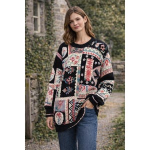 May include: A patterned jumper with a black background and a mix of floral and geometric designs. The jumper has a round neck and long sleeves. The design incorporates various textures and colours, creating a cosy and stylish look. The jumper is a comfortable fit.