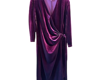 May include: A long-sleeved burgundy velvet wrap dress with a V-neckline and a tie at the waist.