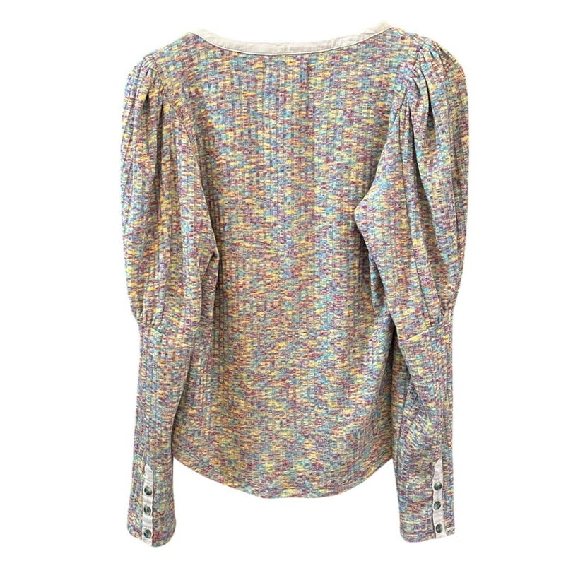 May include: A long-sleeved, multi-colored, knit top with a scoop neck and button detailing on the cuffs.