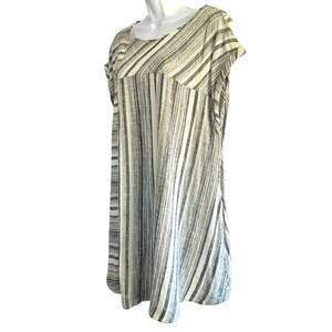 May include: A white and gray striped short-sleeved dress with a scoop neck.