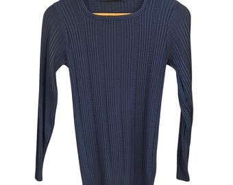 May include: A dark navy blue long-sleeve sweater featuring a vertical ribbed knit pattern and a crew neckline. The garment includes a black interior neck label with the text Givenchy Sport printed in gold lettering, hanging on a wooden hanger.