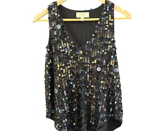 May include: A sleeveless black sequined top with a V-neckline. The sequins are iridescent and have a variety of colors, including blue, green, and purple.