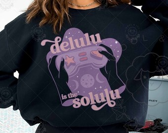May include: Black sweatshirt with a purple and pink graphic of a video game controller with the text "delulu is the soluju" printed on it.