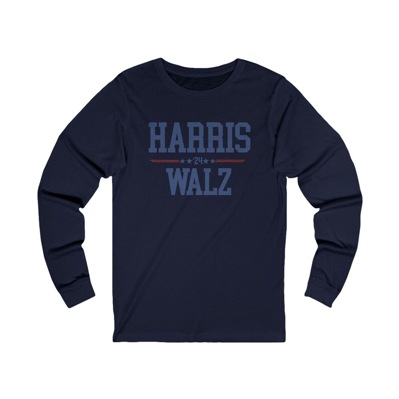 May include: Navy blue long-sleeve shirt with the text "HARRIS WALZ" in blue with red stars above the text.
