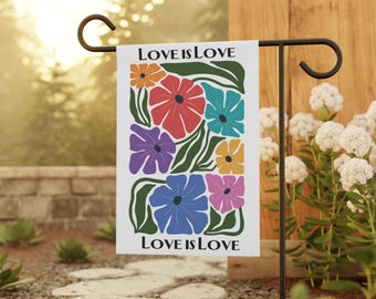 May include: A white garden flag with a floral design and the text "LOVE IS LOVE". The flowers are in shades of red, orange, yellow, blue, purple, and pink.