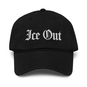 May include: Black baseball cap with the embroidered text "Ice Out" in a gothic font. The cap has a curved brim and a button on top. The hat is made of a soft material.