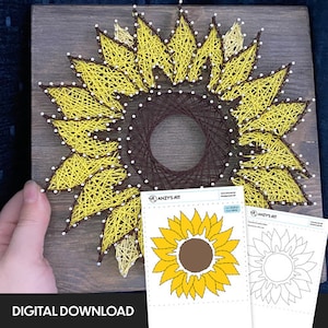 May include: A sunflower string art piece with yellow petals and a brown center, mounted on a wooden board. The words "DIGITAL DOWNLOAD" are at the bottom. Two sheets of paper with sunflower designs are also visible.