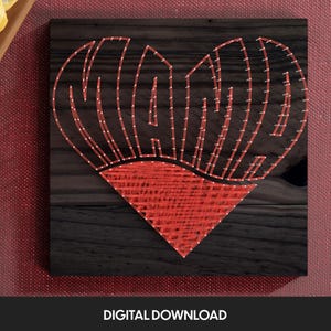 May include: A red string art design of the word "MOM" in a heart shape on a dark wood background.