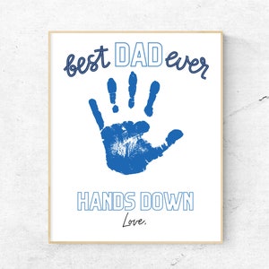 May include: A white printable sign with a blue handprint and the text "best DAD ever HANDS DOWN Love."