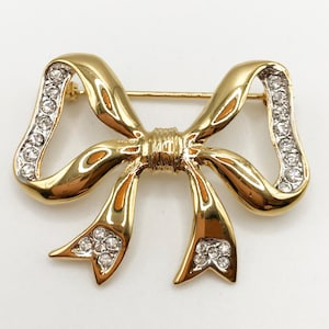 Vintage classic gold-tone bow brooch pin with clear rhinestones