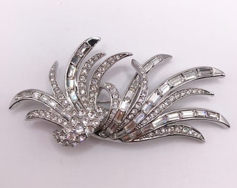 Vintage signed Nolan Miller silver tone brooch pin with feather design with clear rhinestones