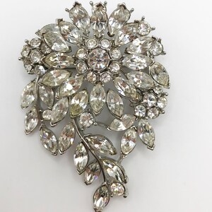 Vintage silver tone floral brooch pin with clear rhinestones