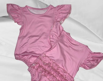 Mono de bebé con volantes rosa: Body de bebé sublimado