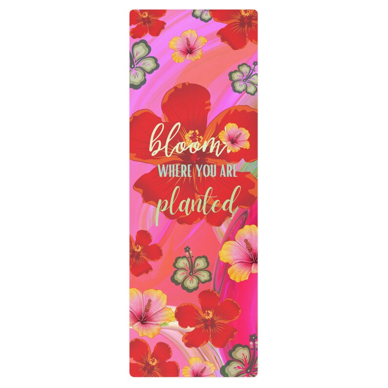 May include: A pink yoga mat with a floral design and the text "bloom where you are planted".