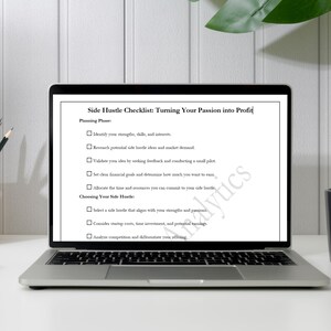 May include: A checklist on a laptop screen titled "Side Hustle Checklist: Turning Your Passion into Profit". The checklist is divided into two sections: "Planning Phase" and "Choosing Your Side Hustle". Each section has a list of steps to take when starting a side hustle.