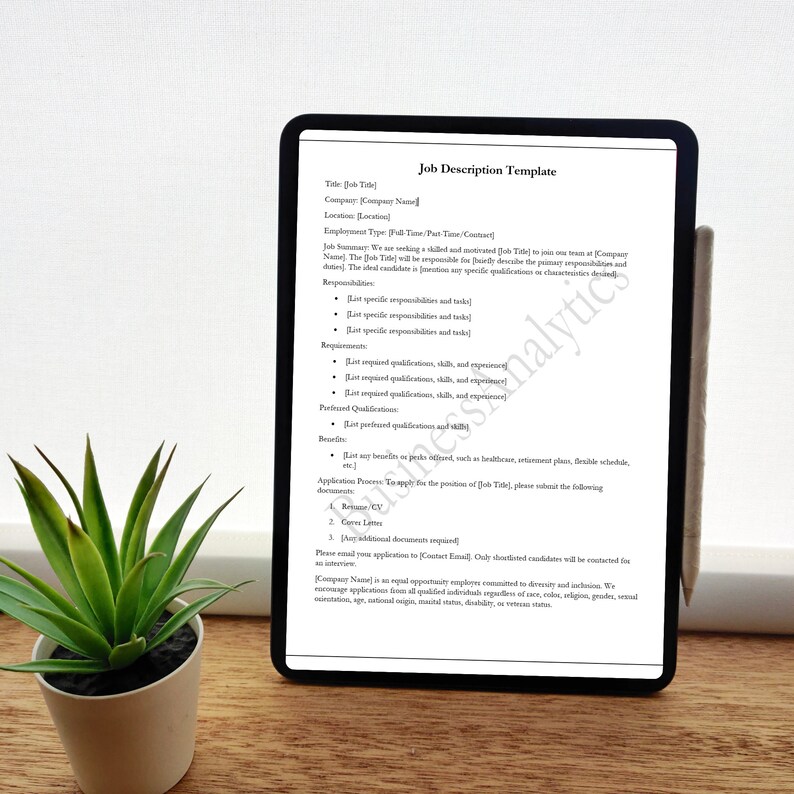 May include: A black and white job description template displayed on a tablet screen. The template includes sections for job title, company, location, employment type, job summary, responsibilities, requirements, preferred qualifications, benefits, and application process.