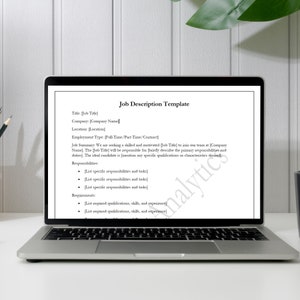 May include: Job description template displayed on a laptop screen. The template includes sections for job title, company, location, employment type, job summary, responsibilities, and requirements.