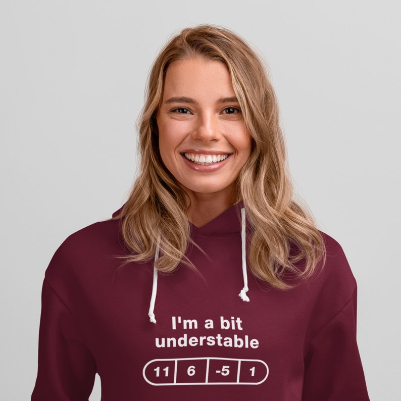 May include: A maroon hoodie with a white graphic that says "I'm a bit understandable" with a row of four white circles containing the numbers 11, 6, -5, and 1.