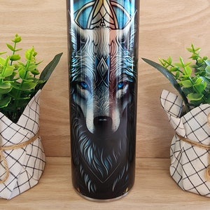 20oz skinny tumbler. Wolf with blue eyes design. With shiny iridescent coloring that resembles stained glass. Unique and beautiful colors
