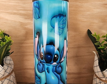 Tumbler/cup. Stitch from Lilo and Stitch design. With flowers and very colorful background. 20oz skinny tumbler.
