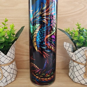 20oz skinny tumbler. Dragon full body with shiny iridescent coloring that resembles stained glass. Unique and beautiful.