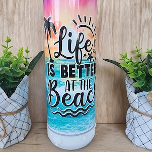 20oz Bluetooth speaker Tumbler/cup. Life's better at the beach/sunset and sand, sublimation print. Stainless steel. Speaker unscrews to wash