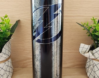 20oz skinny tumbler. Tampa Bay Lighting hockey. With shiny iridescent coloring that resembles stained glass. Unique and beautiful.