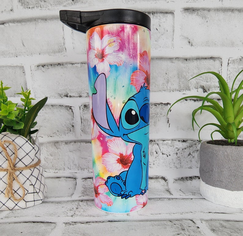 Tumbler/cup. Stitch from Lilo and Stitch design. With hibiscus flowers and very colorful background. 20oz skinny tumbler. image 2