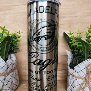 20oz skinny tumbler. Philadelphia Eagles Football team with beer can design. Shiny iridescent coloring/aluminum can look.