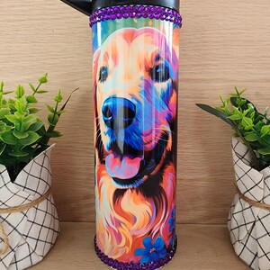 Tumbler/cup. 20oz skinny tumbler. Golden Retriever dog, very bright vibrant colors, floral patterned. Bling/rhinestones on top and bottom