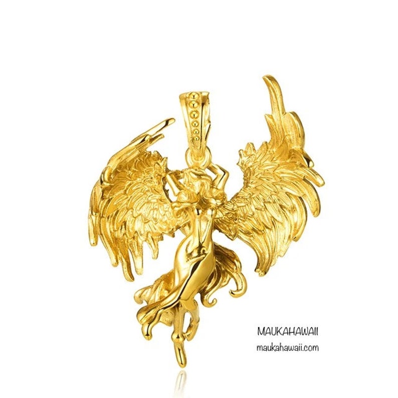 May include: A gold pendant featuring a detailed sculpture of an angel with outstretched wings. The pendant is a delicate and intricate piece of jewelry.
