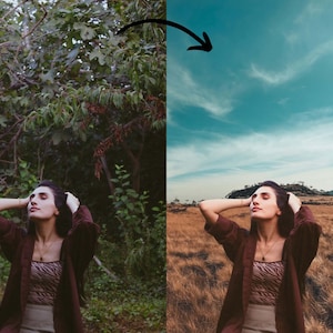 May include: A woman with long dark hair is standing in a field of tall grass. She is wearing a brown jacket over a striped shirt and a skirt. The sky is blue with white clouds.