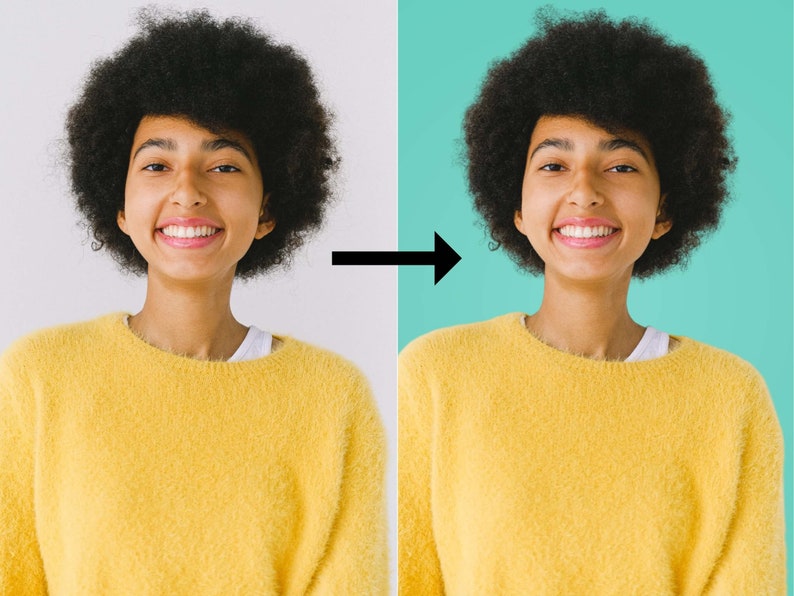 May include: A person with curly dark brown hair is smiling and wearing a yellow fuzzy sweater. The person is standing in front of a white background.