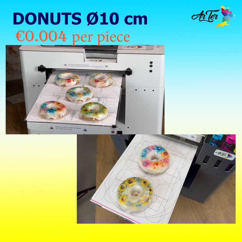 May include: A white and gray donut printer with a tray of colorful donuts with floral designs. The printer has a digital display and a control panel. The text on the image reads "DONUTS &Oslash;10 cm &euro;0.004 per piece".