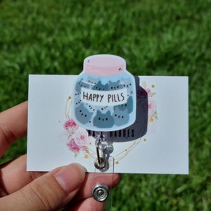 Happy pills badge reel