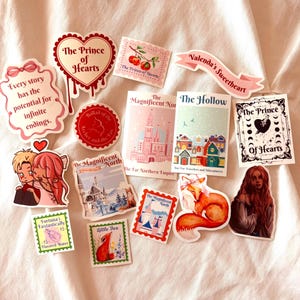 May include: A collection of stickers with various designs and text. The stickers feature illustrations of a castle, a fox, and couples, along with phrases like "The Prince of Hearts" and "Every story has the potential for infinite endings."