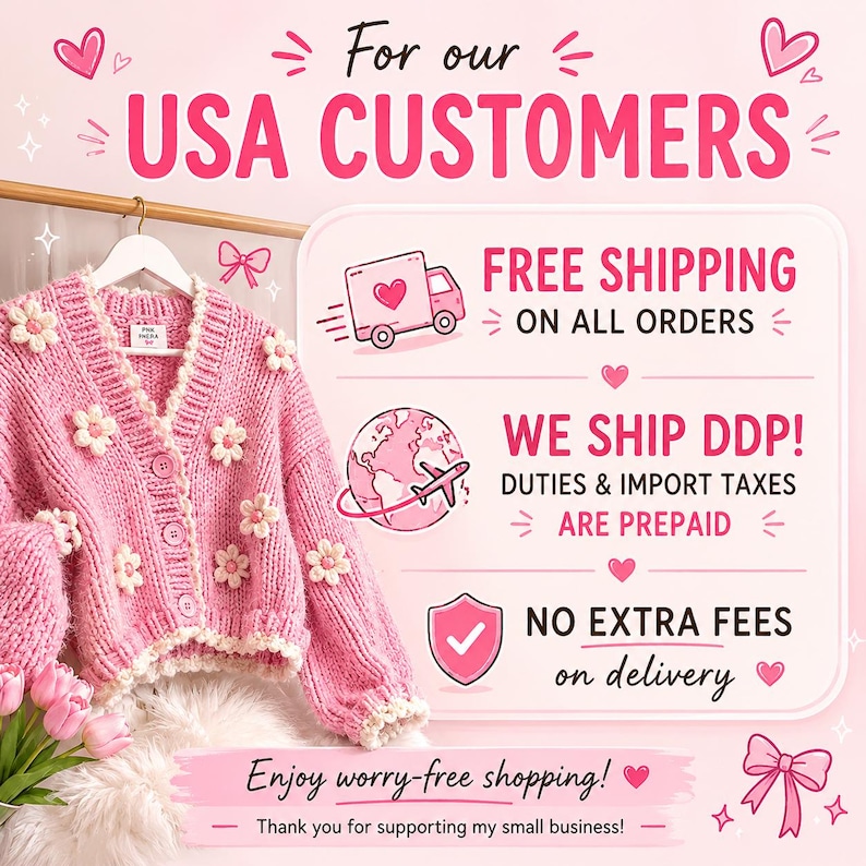 May include: A pink cardigan with white flower appliqu&eacute;s hangs on a gold rod. The image includes text that reads "For our USA CUSTOMERS" and "Enjoy worry-free shopping!" with additional text about shipping.